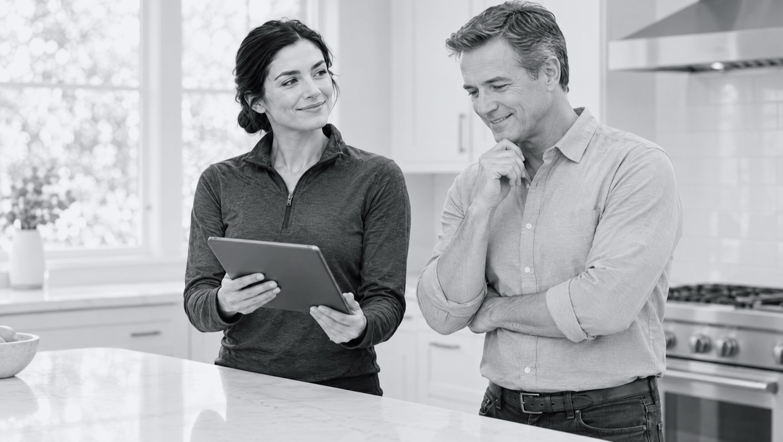 A technician showing a homeowner a video of the job on her tablet.
