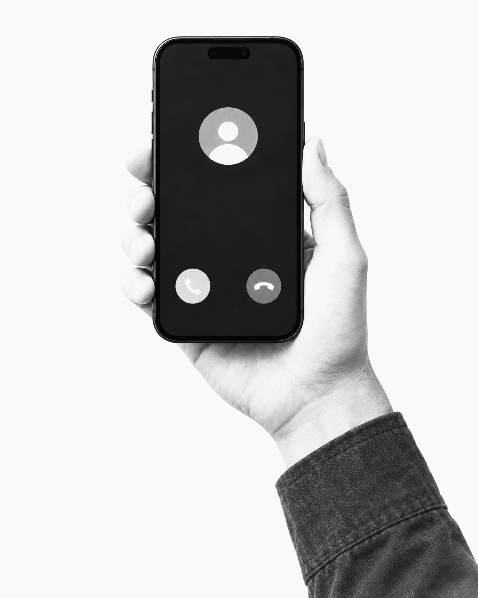 A hand holding a phone with an incoming call on screen, the answer and decline buttons showing.